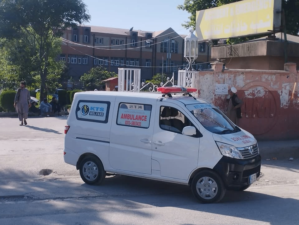 Ambulance service helping patient